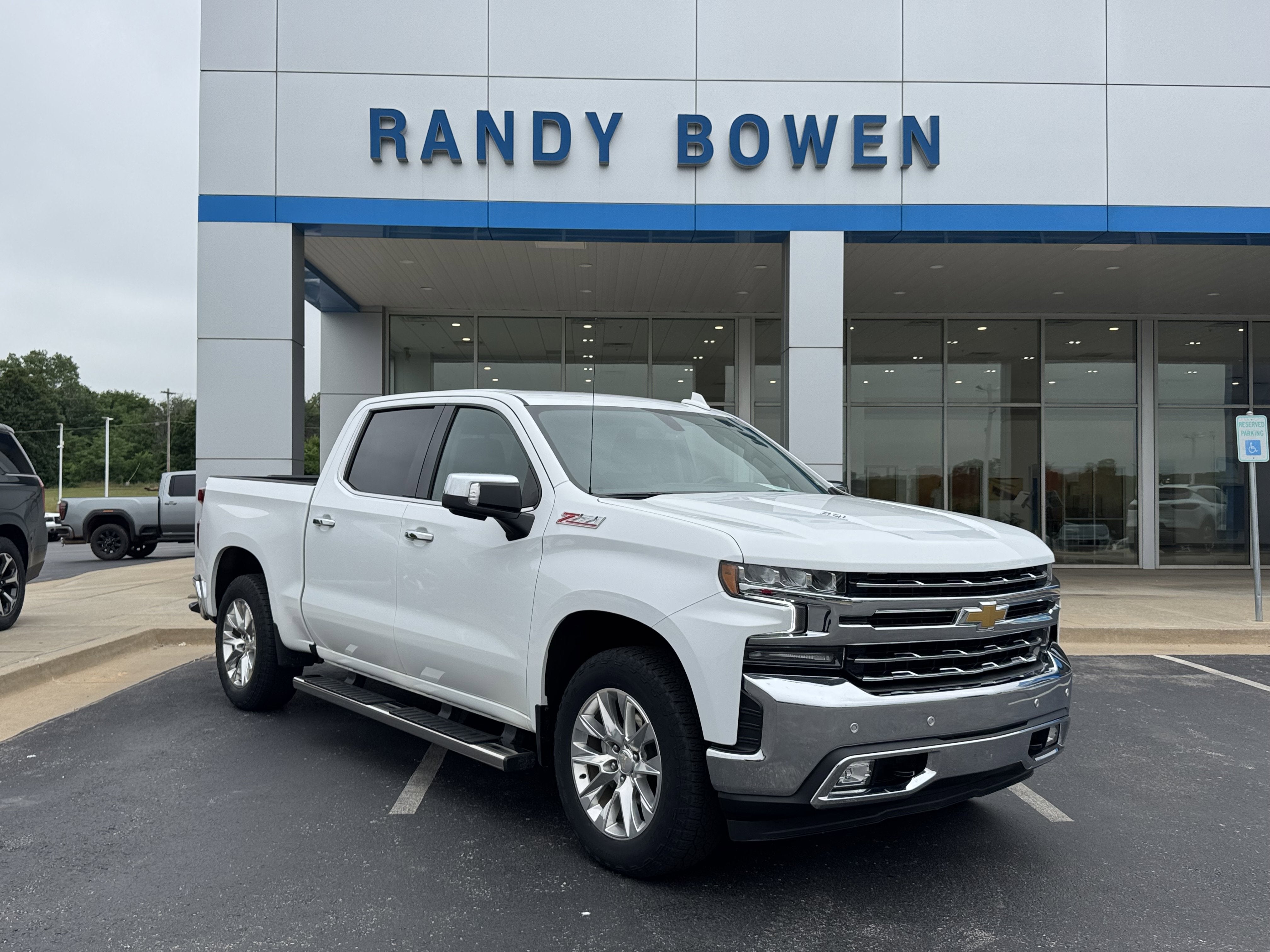 2021 Chevrolet Silverado 1500 LTZ in Summit White — front three-quarter view