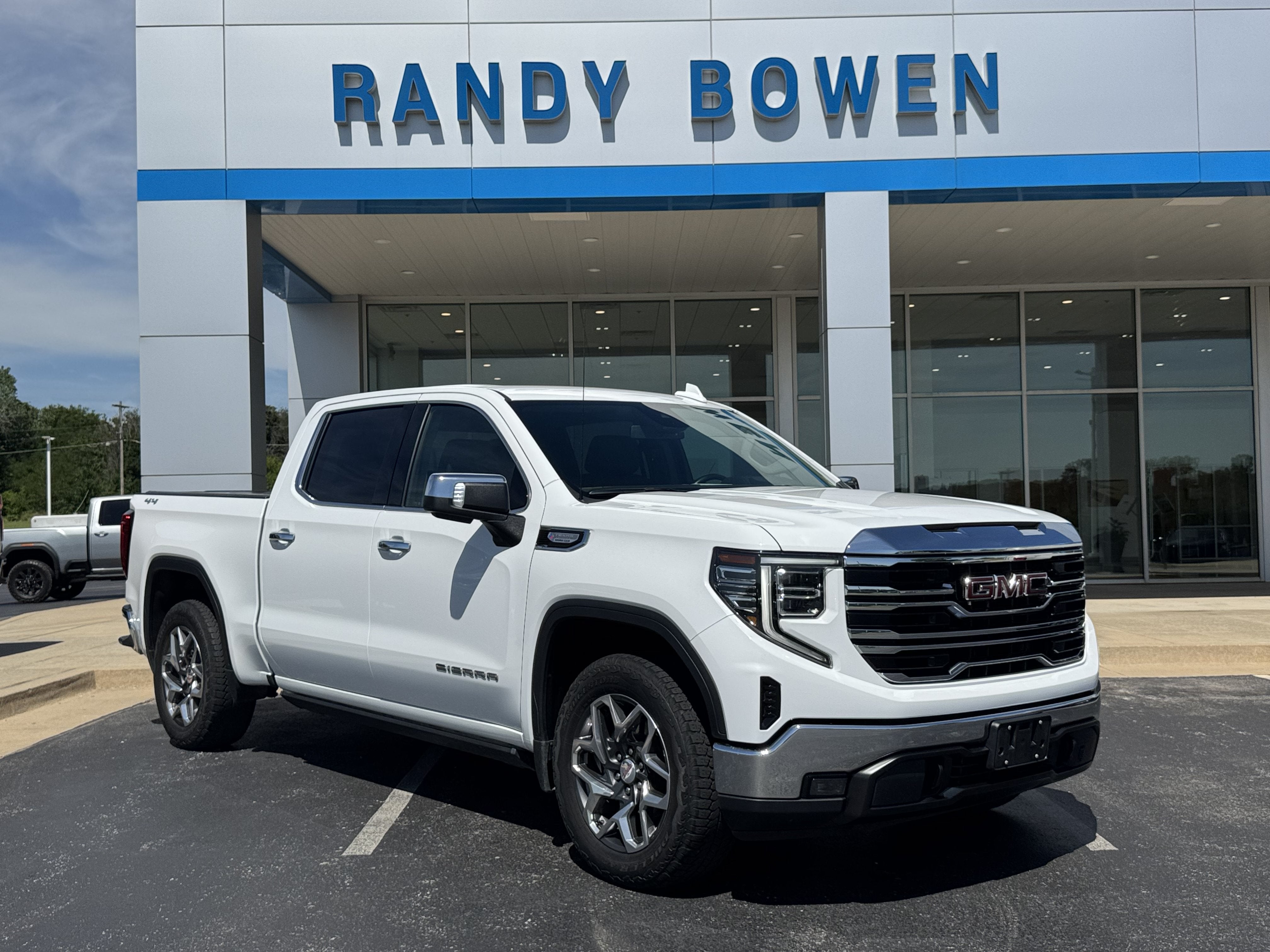 2023 GMC Sierra 1500 SLT in Summit White — front three-quarter view